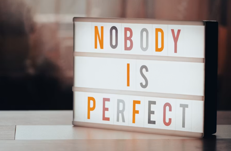 Sign that reads "nobody is perfect"