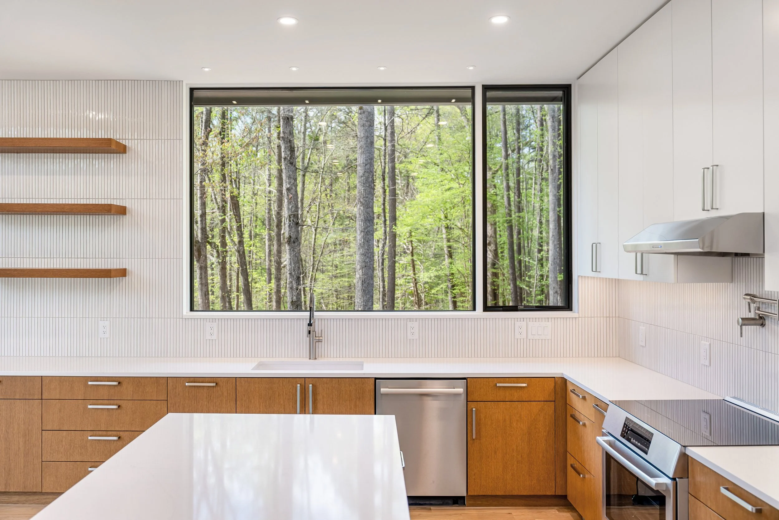  Warm, minimal palette and a dramatic view from the kitchen window. 