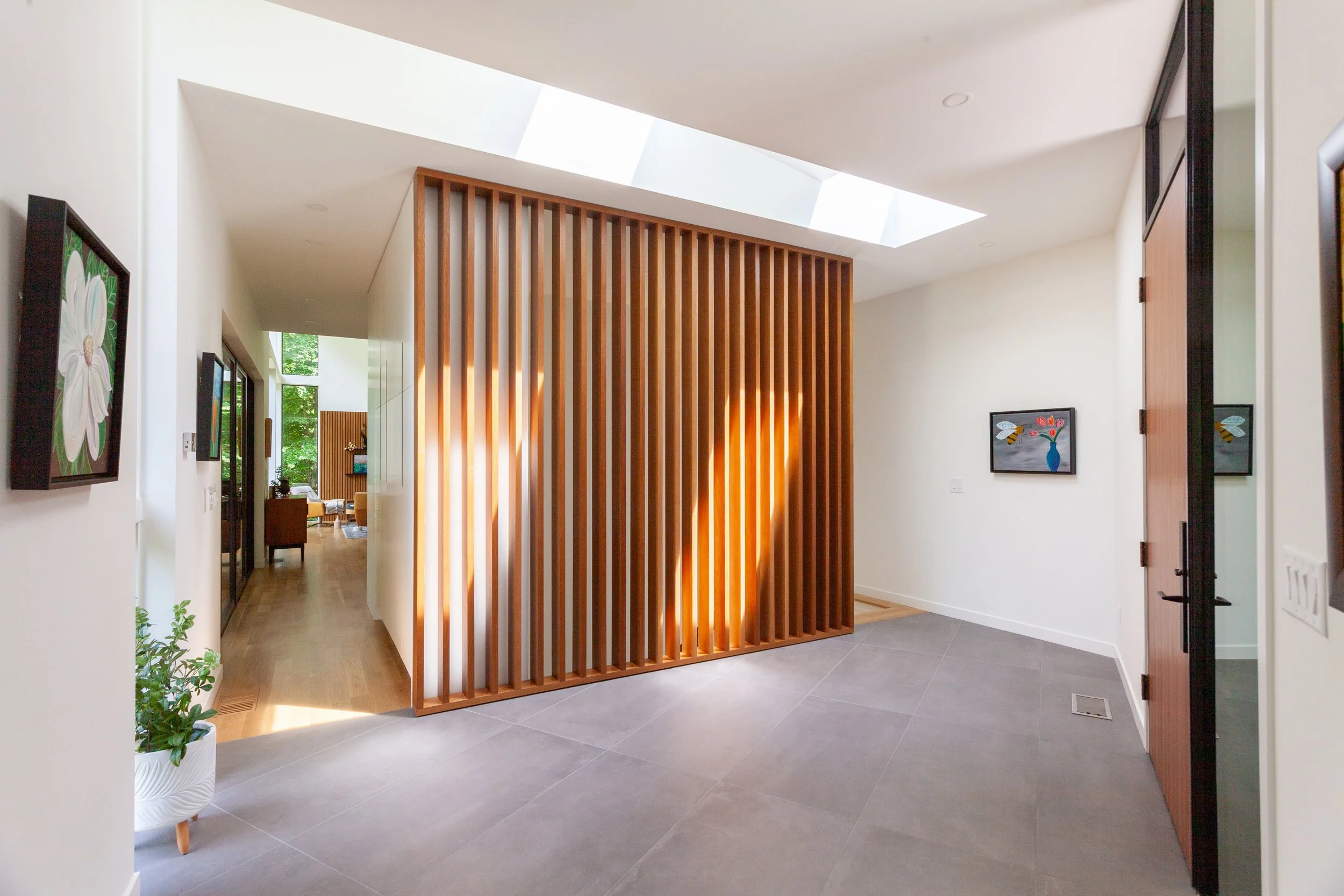  View of foyer with main living spaces visible at back left. 
