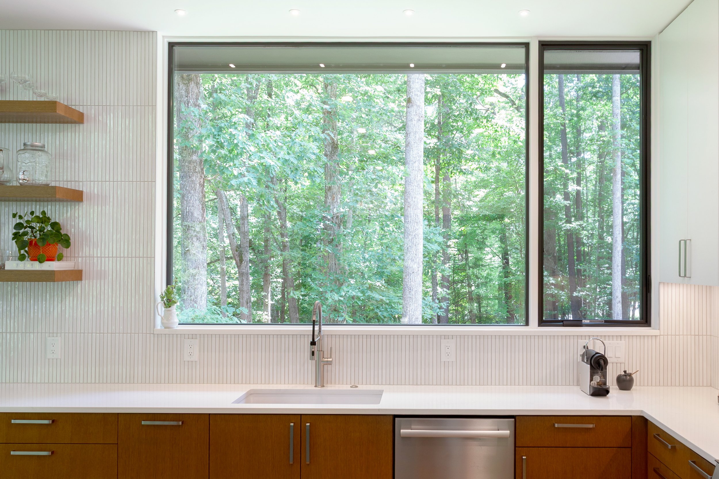  Warm, minimal palette and a dramatic view from the kitchen window. 