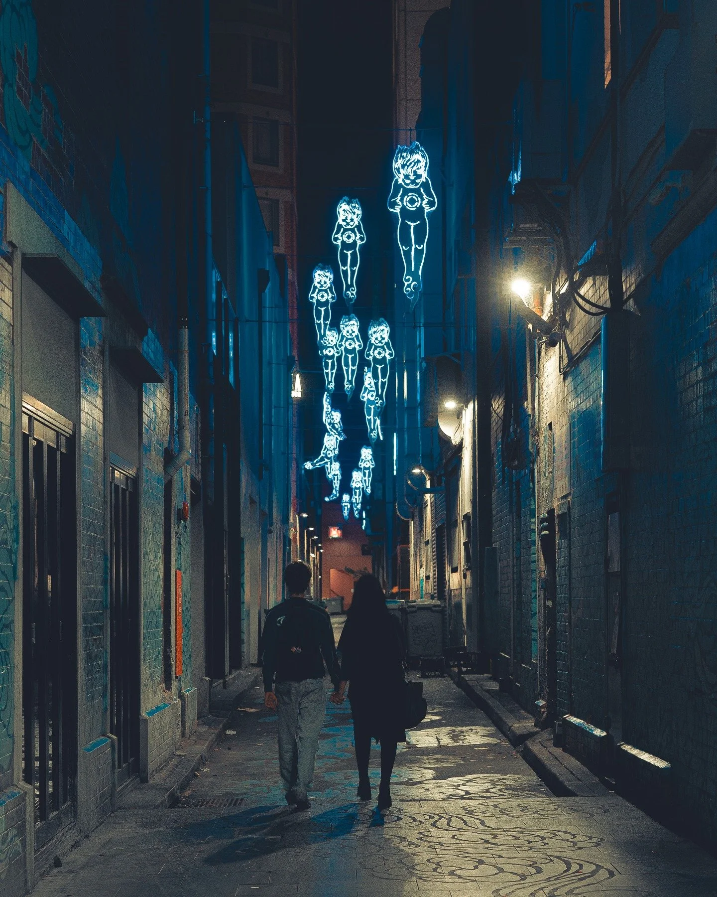 Faceless Sydney Pt:1 &ndash; Tucked away in the heart of Sydney&rsquo;s Chinatown, Kimber Lane transforms after dark. Under the glow of Jason Wing&rsquo;s &ldquo;In Between Two Worlds,&rdquo; a couple walks hand in hand&mdash;faces unseen, stories un