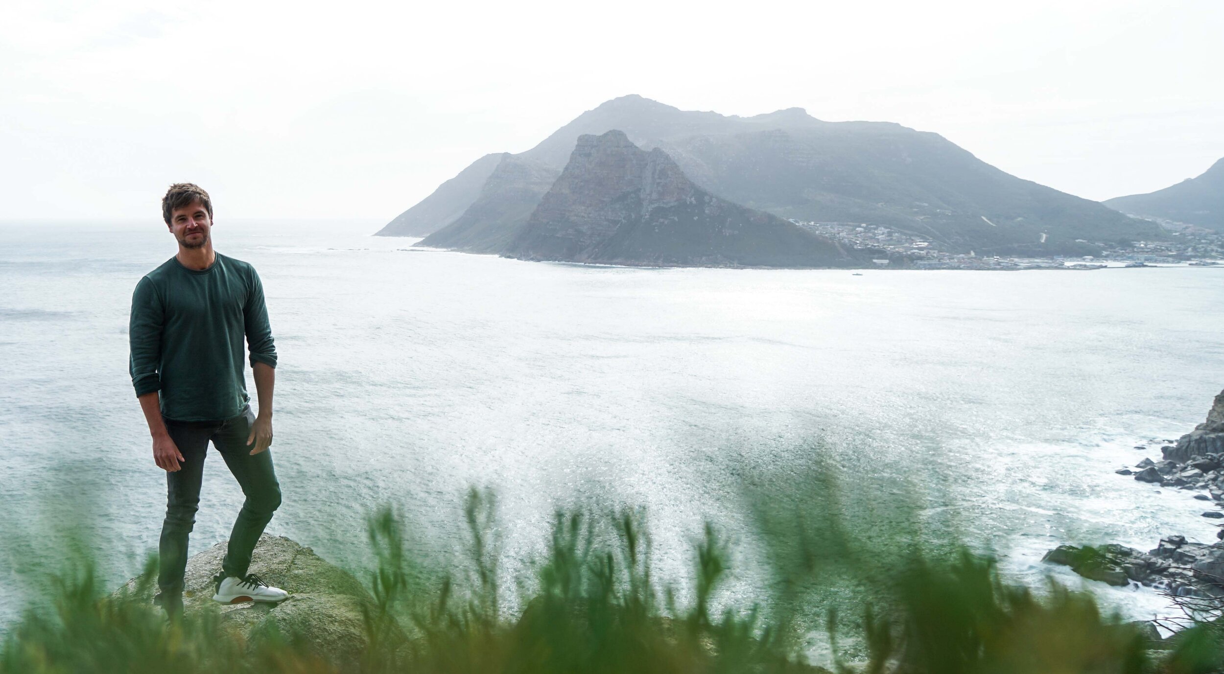 Chris Dennett, TV presenter and adventurer, scaling the cliffs of Chapman's Beach, Cape Town.