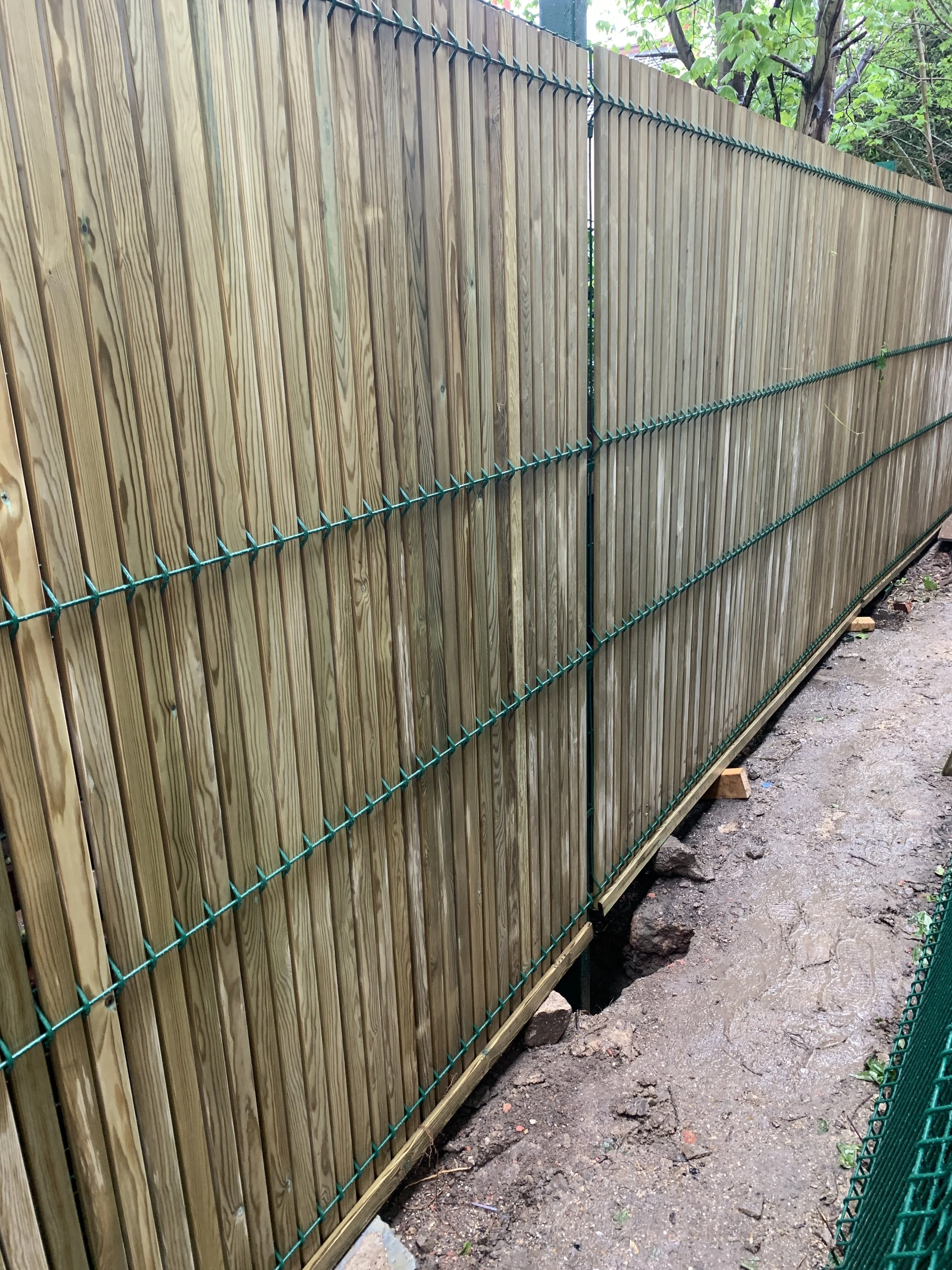 135 metres of our new timber slatted fencing being installed