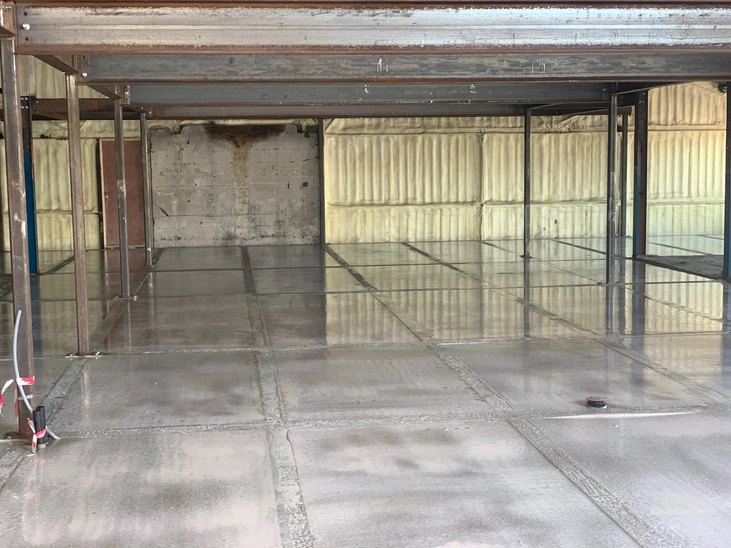 Our concrete pour looking like an ice rink.  Wet underfloor heating next!