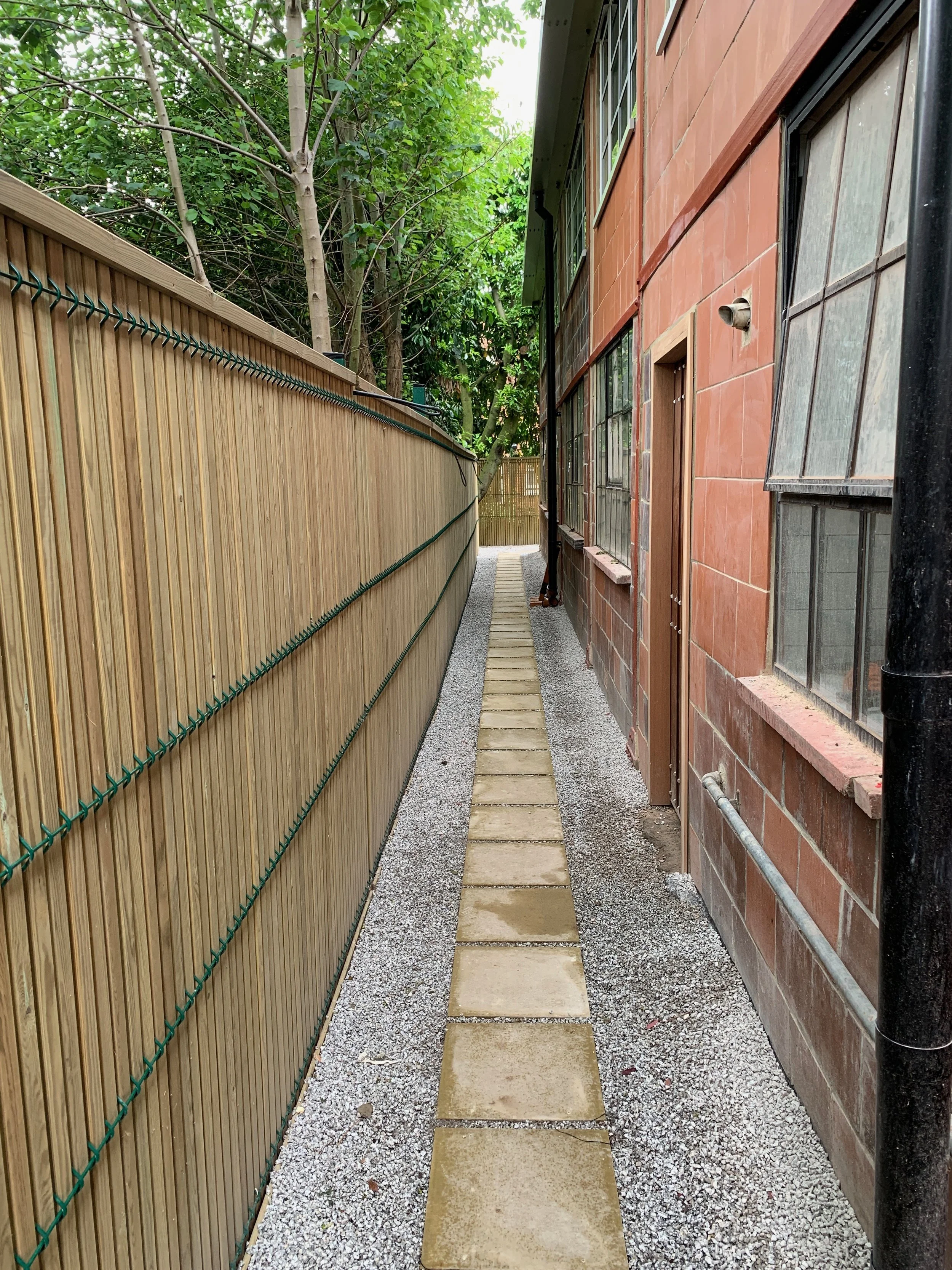 Concrete pedestrian pavers go down