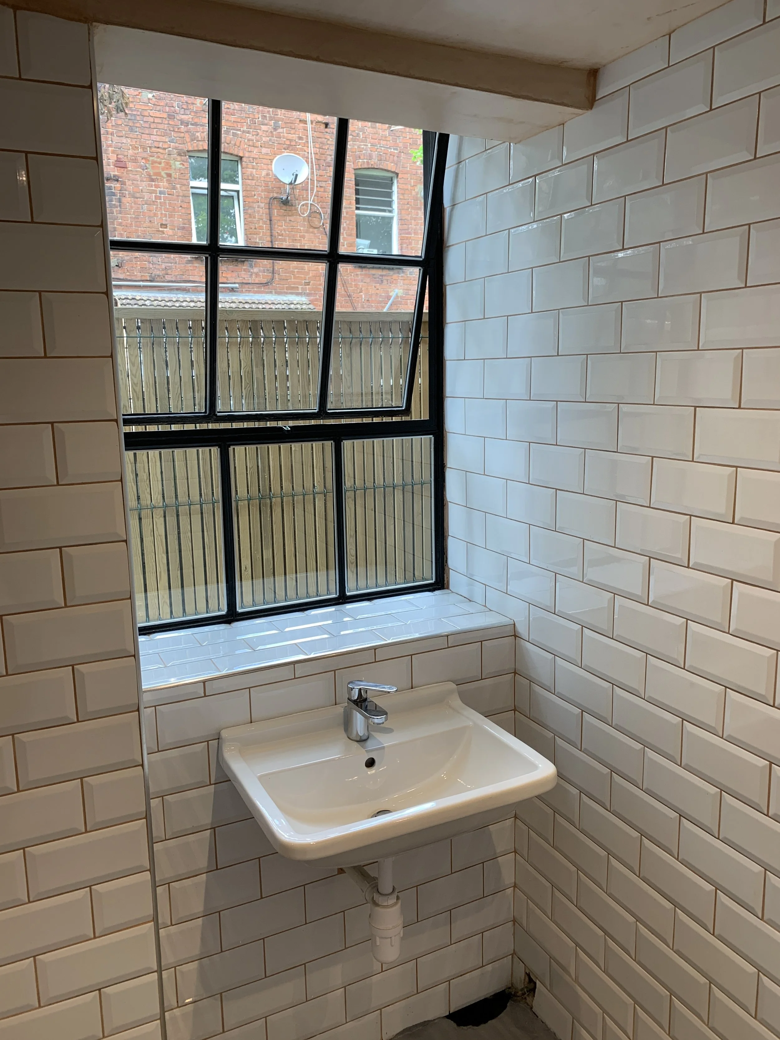 Perfectly proportioned Sanitary Ware under original Crittal window