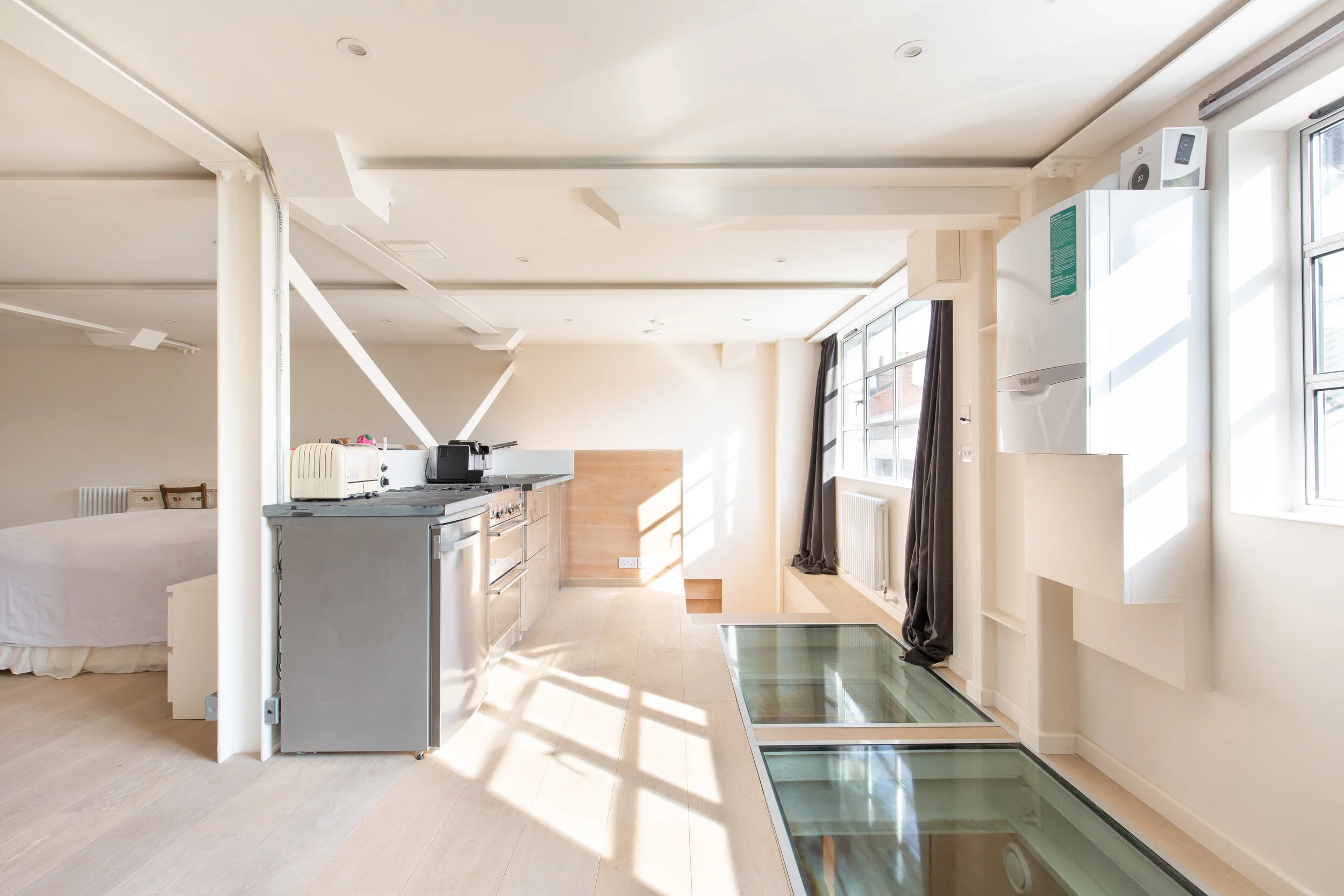 Galley kitchen and structural floor glass