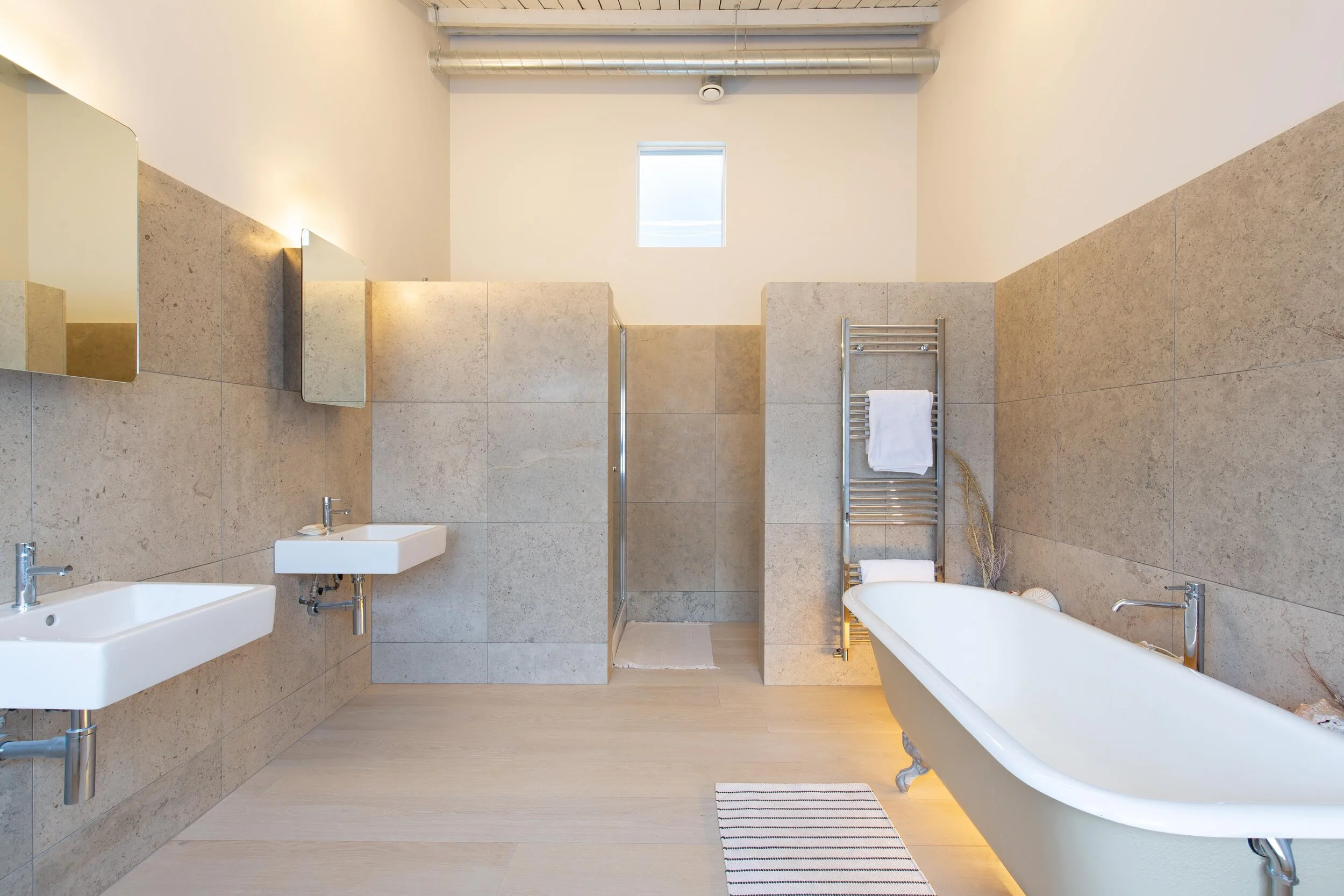 Our reclaimed cast iron bath look great alongside double sinks 