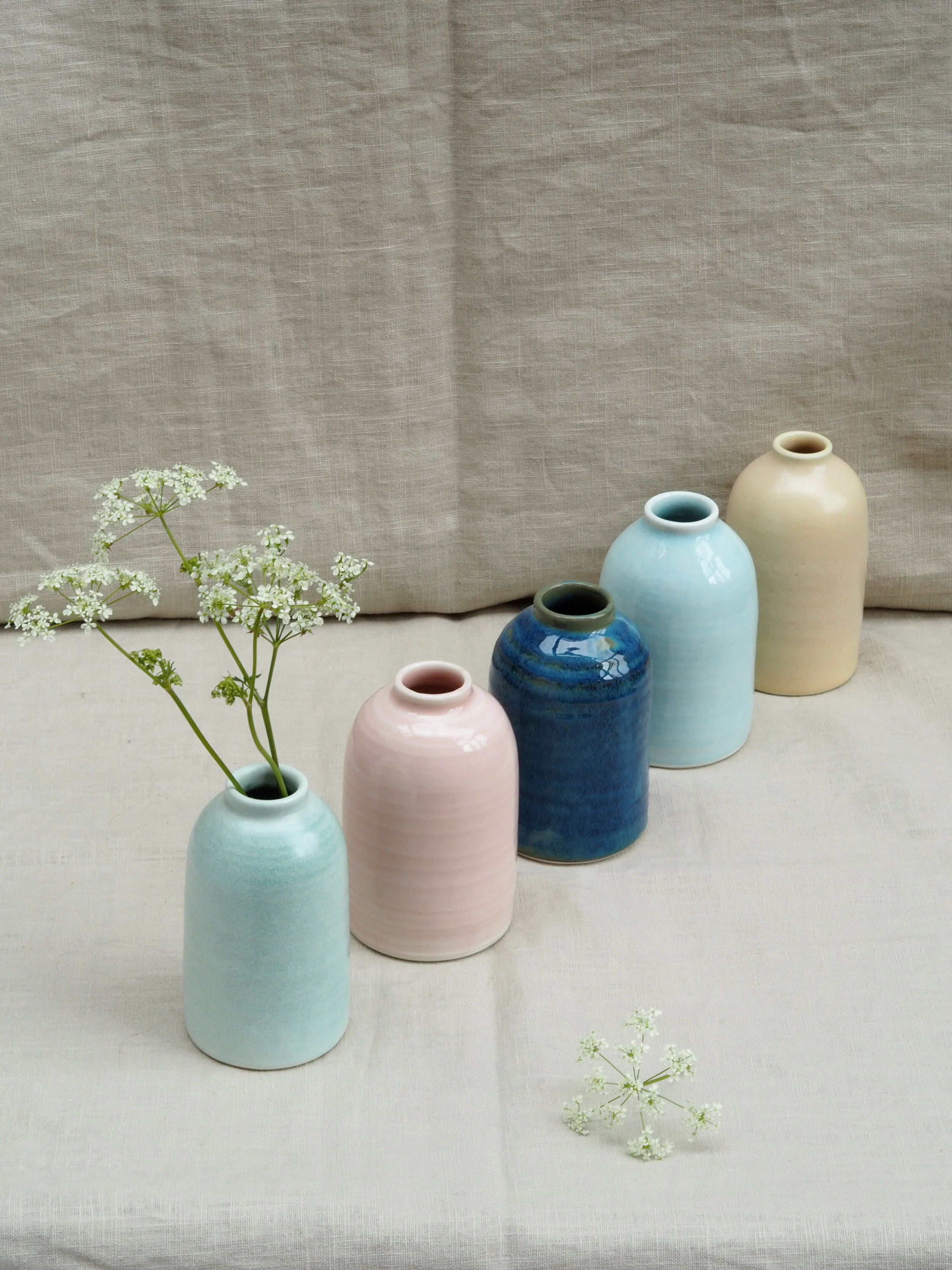 Porcelain milk bottles in sea-side shades