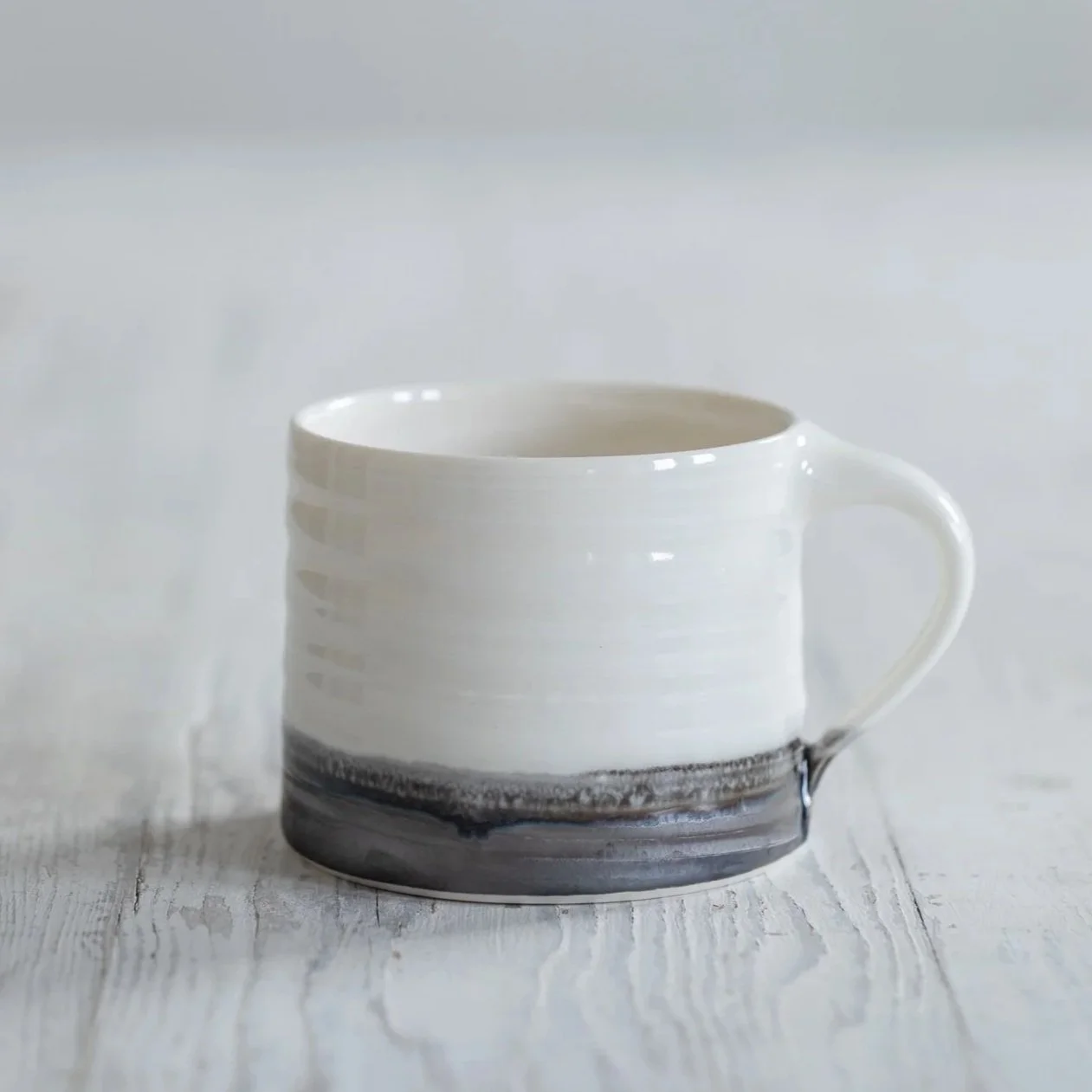 White+and+bronze+porcelain+mug.jpg