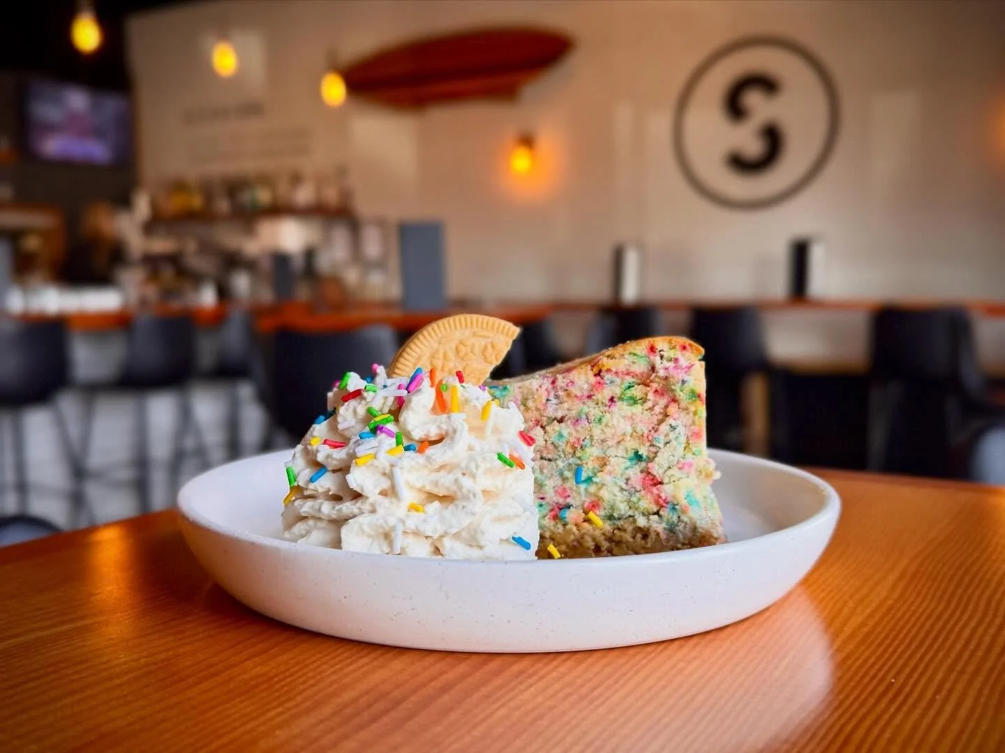 🎉 The Birthday Cheesecake is Back for Year 7! 🎂

We are celebrating 7 amazing years of our Taproom + Kitchen on June 13th, and we are bringing back the ultimate fan favorite to mark the occasion. The Birthday Cake Cheesecake has officially returned