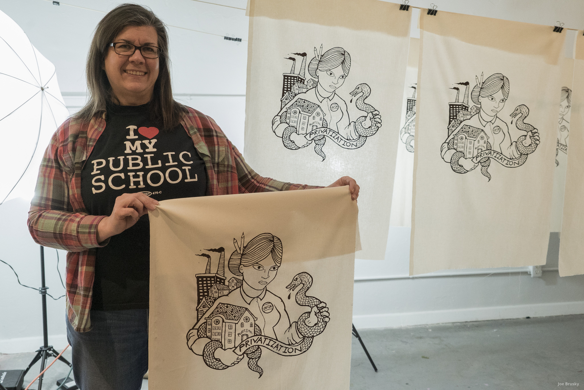  Pro Public Education banners, parachutes, and screen printed picket signs are produced at an art build with Milwaukee Teachers Education Association.  