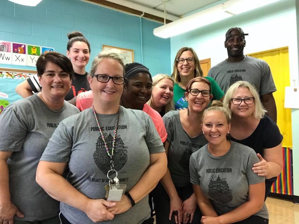  Union teachers wearing “Public Education; The Heart of Our Community” T shirts at school. 
