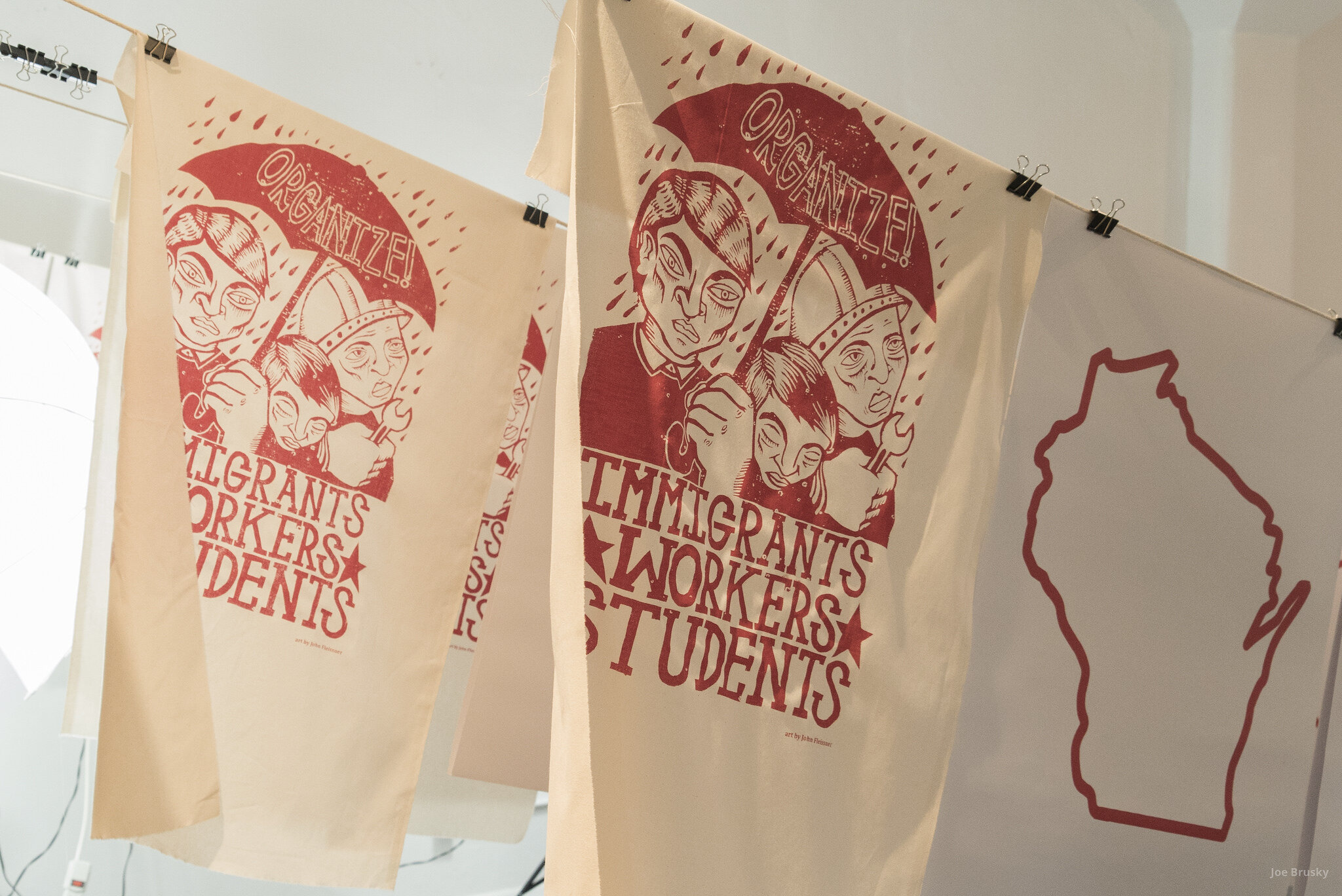  Pro Public Education banners, parachutes, and screen printed picket signs are produced at an art build with Milwaukee Teachers Education Association.  