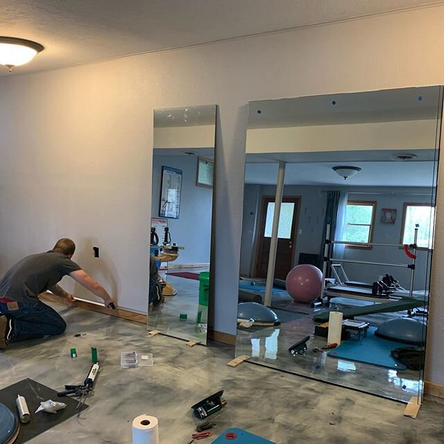 Meanwhile...this is exciting! Mirror installation is in progress. Stay informed. Do not panic. Everything will be ok. #movingforward #moorewellnessstudio #eldoa #pilates #gyrotonic