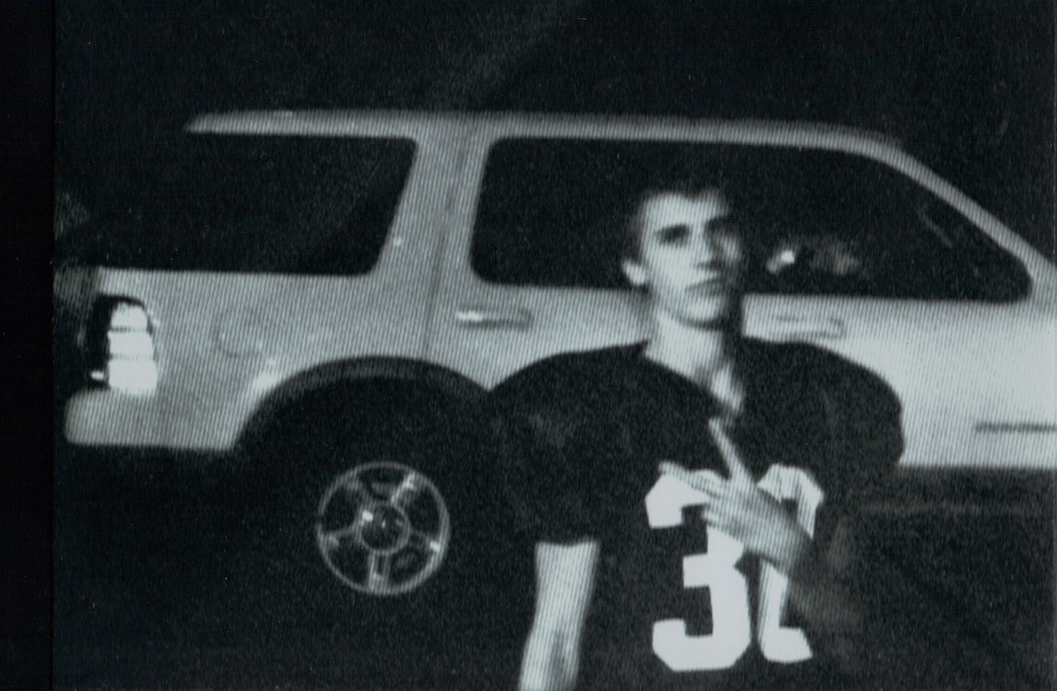 connor football uniform with car.jpg