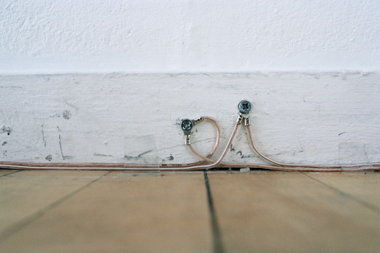 Typically, conductive wire is used to bridge a signal, but in this instance, the attempt was to use the speaker wire to simulate a room size antennae.