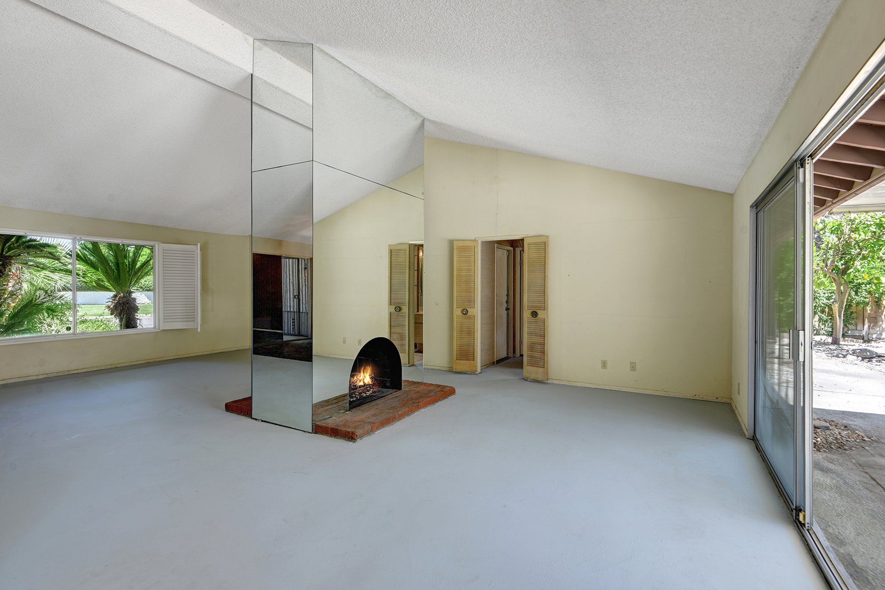 DINING ANGLED THROUGH FIREPLACE TO LIVING MLS.jpg