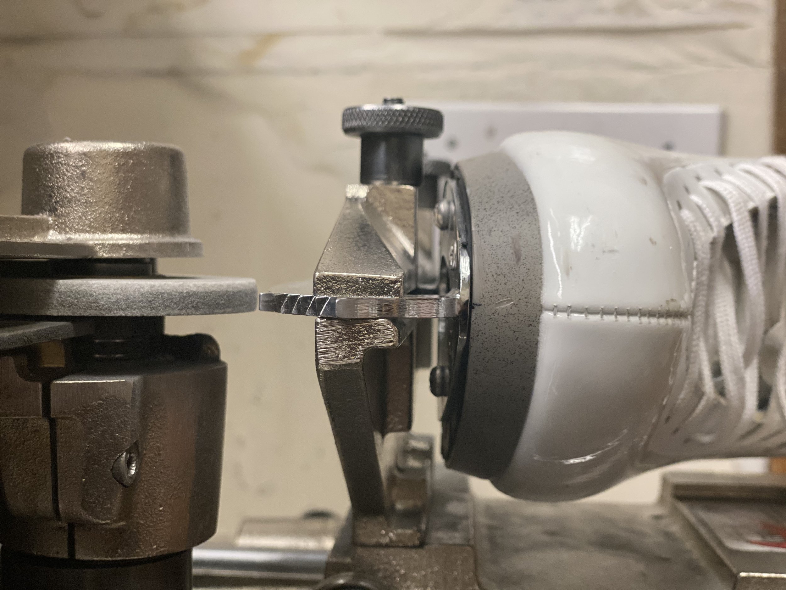 Professional figure skate sharpening and repair setup at Irvine Designs, Sun Valley