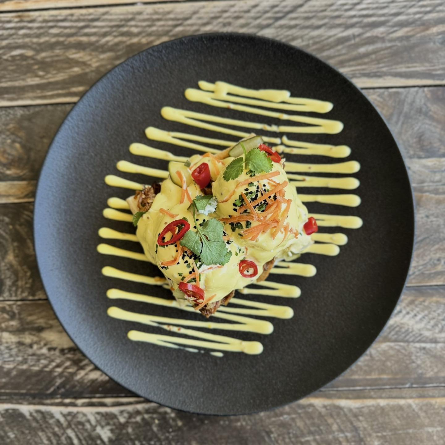 Introducing the star of our new menu:

✨The Banh Mi Benedict ✨

Asian style slow cooked pork shoulder, mustard hollandaise, poached eggs, house pickled carrot &amp; cucumber, coriander &amp; fresh chilli served on a toasted baguette 😮&zwj;💨