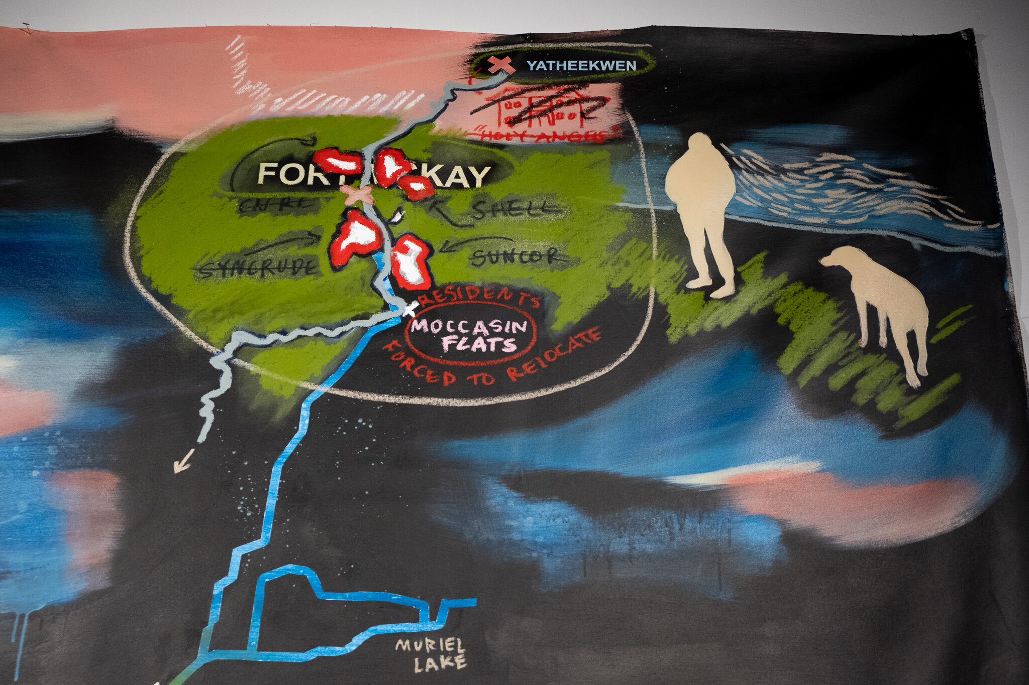  A close-up of the upper section of Lauren Crazybull’s painted map. We’re able to read the place names, as well as get a better view of the light yellow silhouettes of a person and a dog. Near the bottom of this photo, we can see the name “Muriel Lak