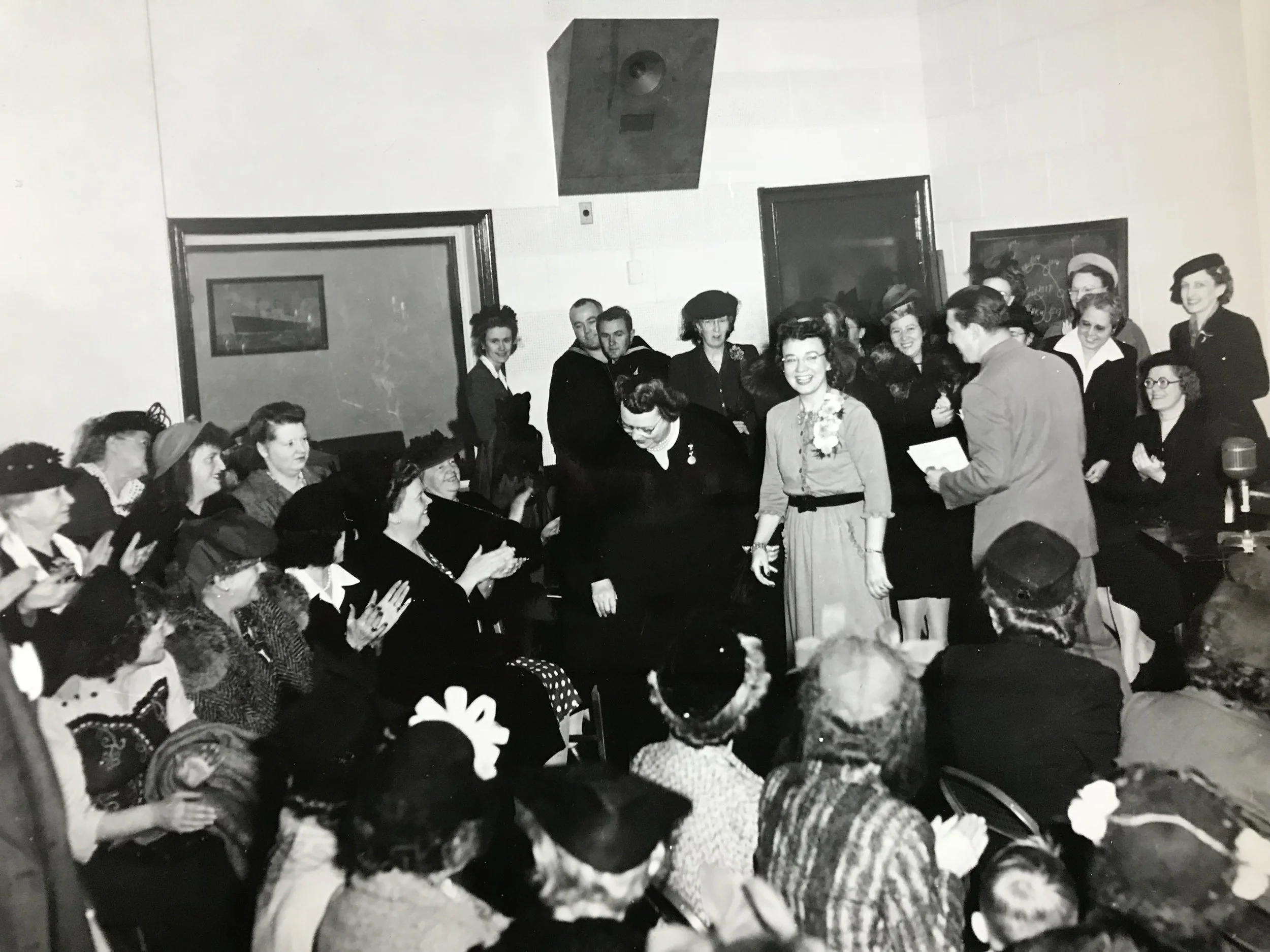 Edith Stevens (center, taking a bow) at the WEEI Radio studio in Boston, MA after her on-air interview. Circa 1950s.