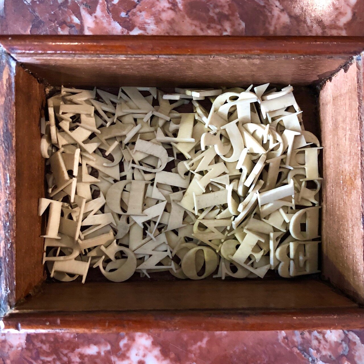 Set of 19th century ivory alphabet letters in original mahogany box, English circa 1860 antique