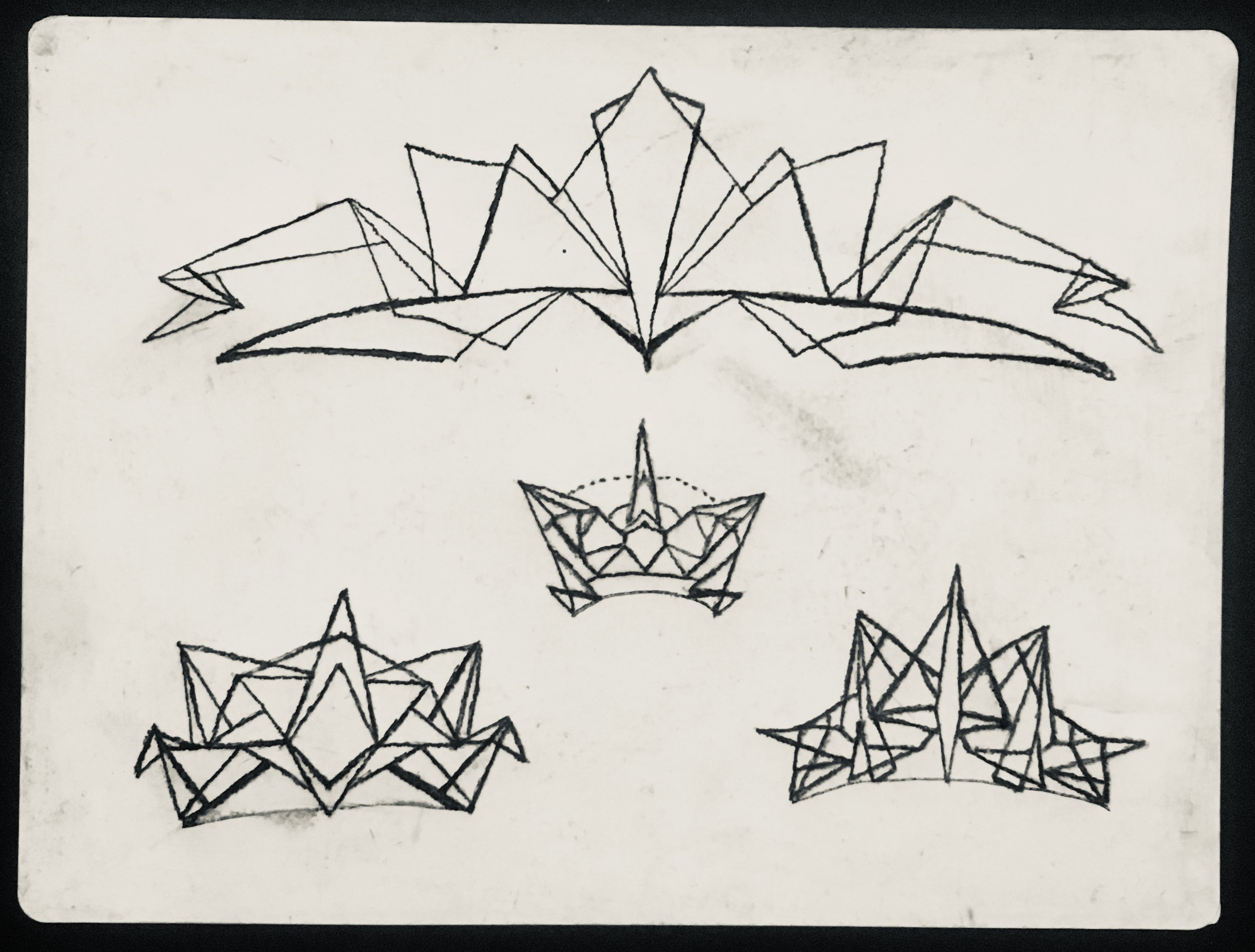 I see these as crowns or a geometric version of tribal