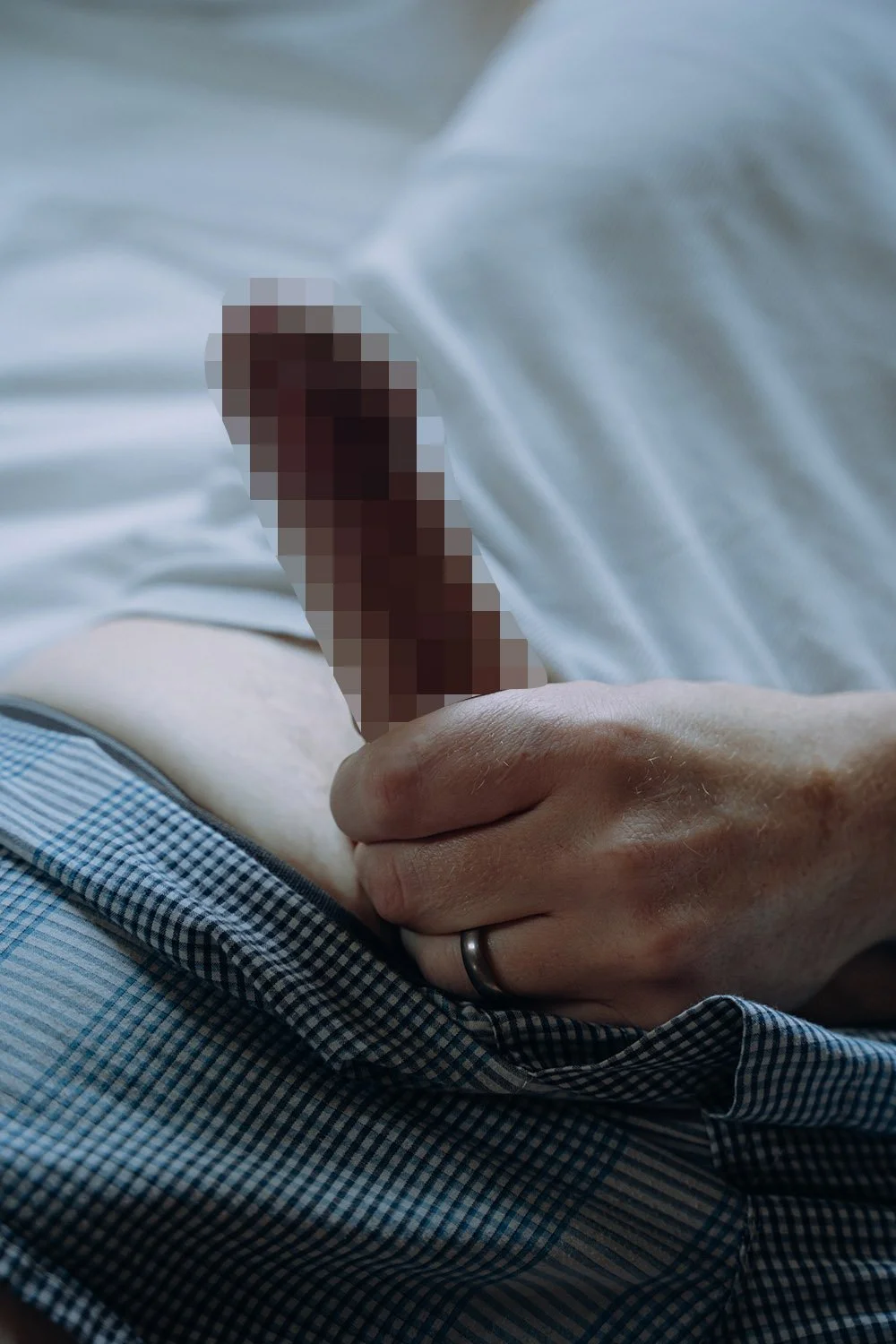 A man holding his hard member posing for an erotic photo session in Hamilton, Ontario
