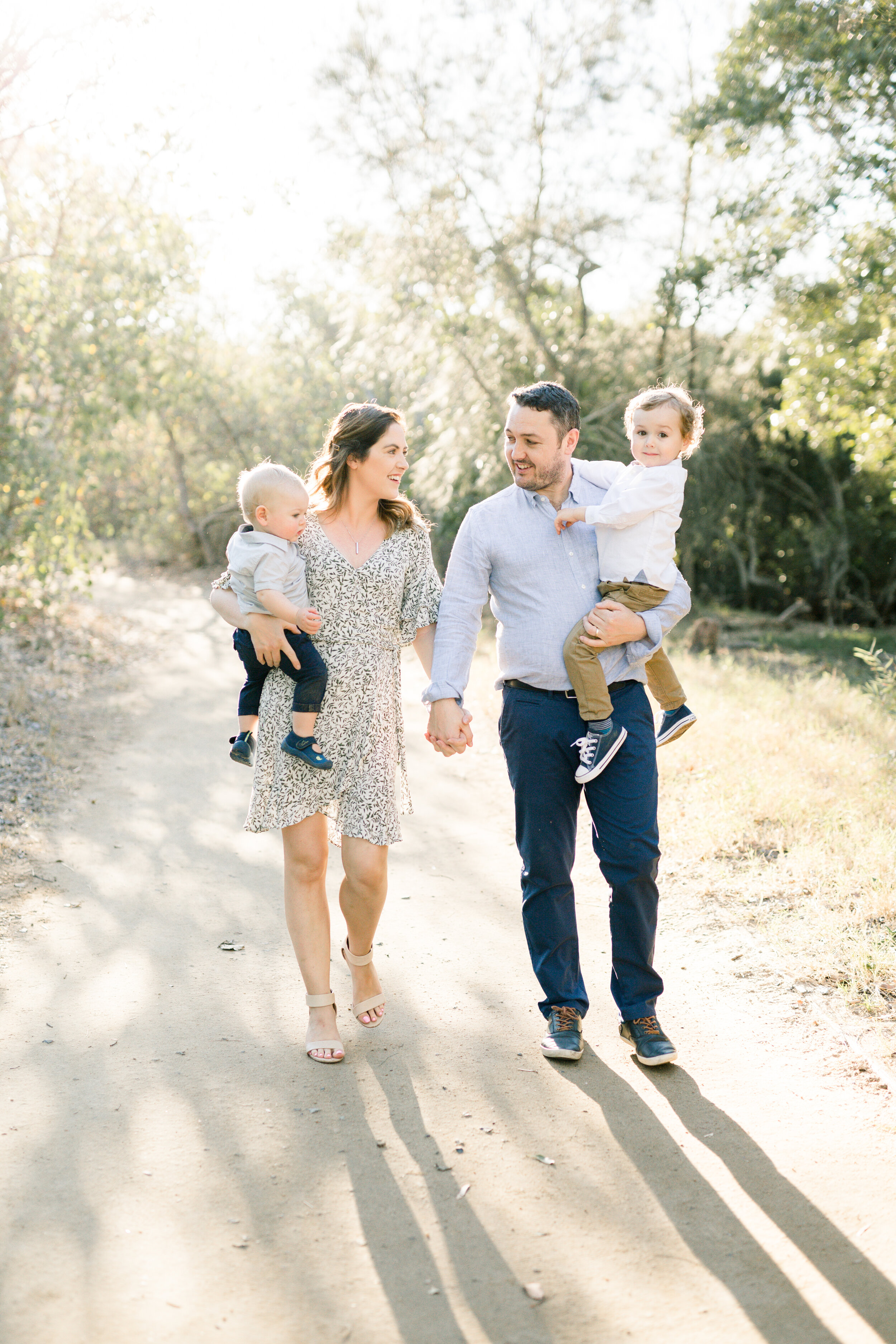 Young family walking along a dirt path