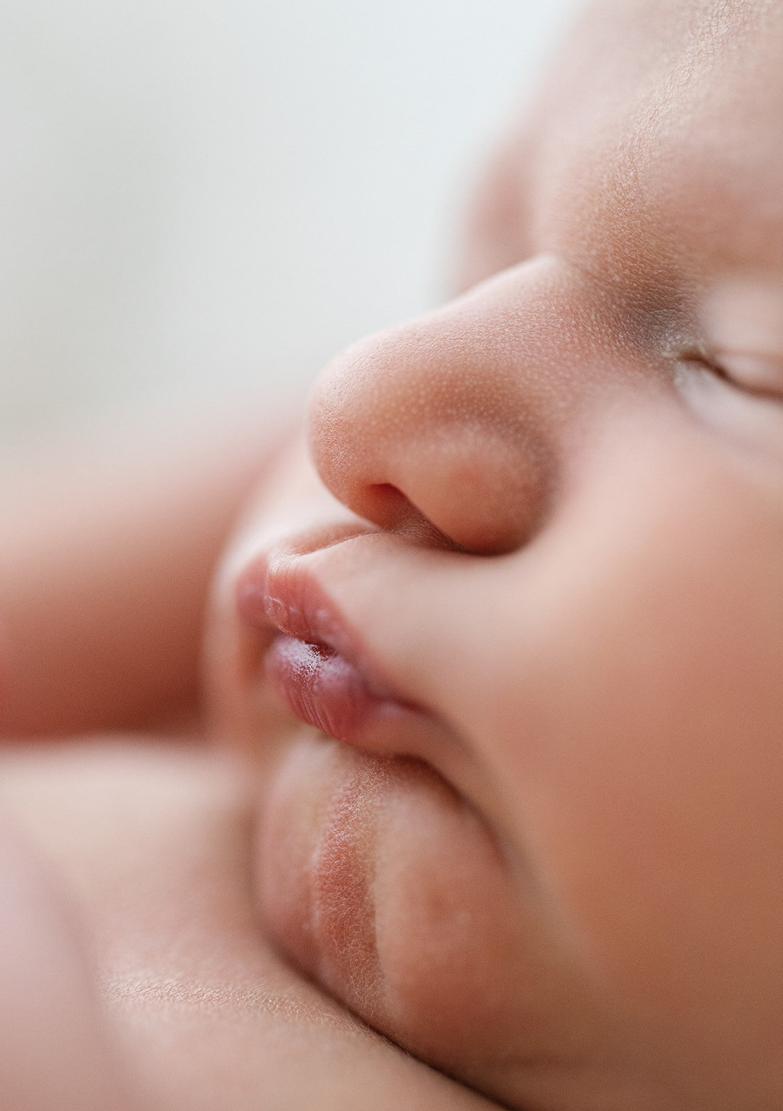 Close up of a newborn pouting 