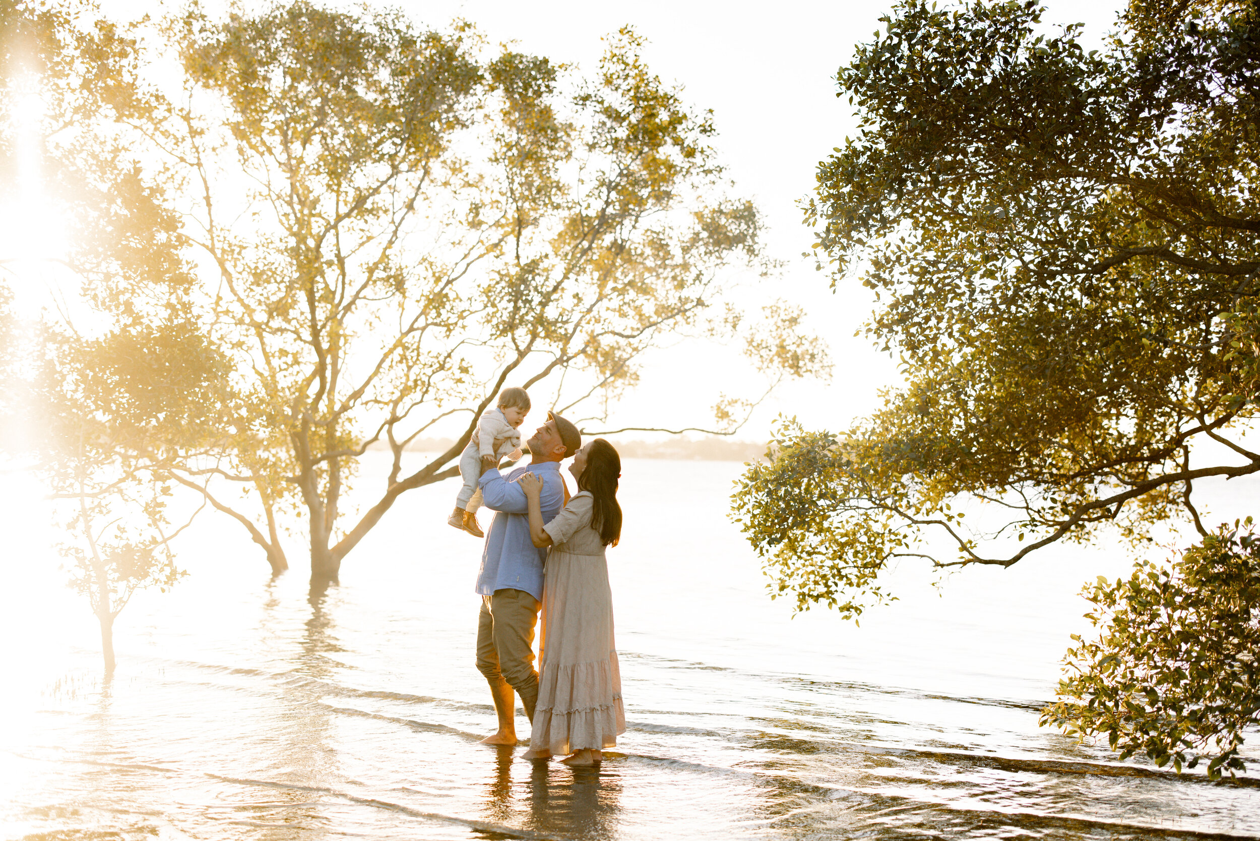 Brisbane family standing together in the mangroves