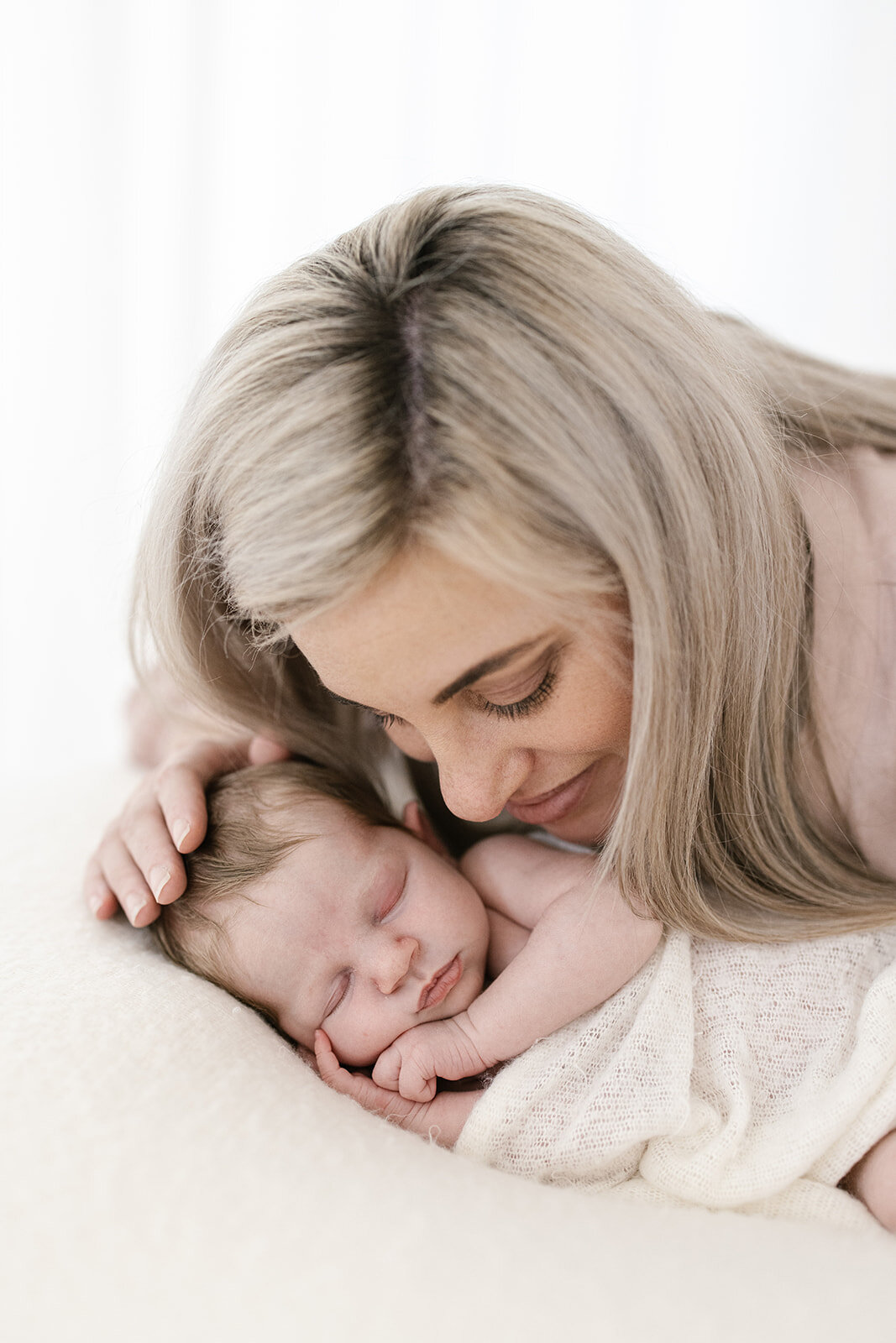 Mother with her sleeping baby girl 