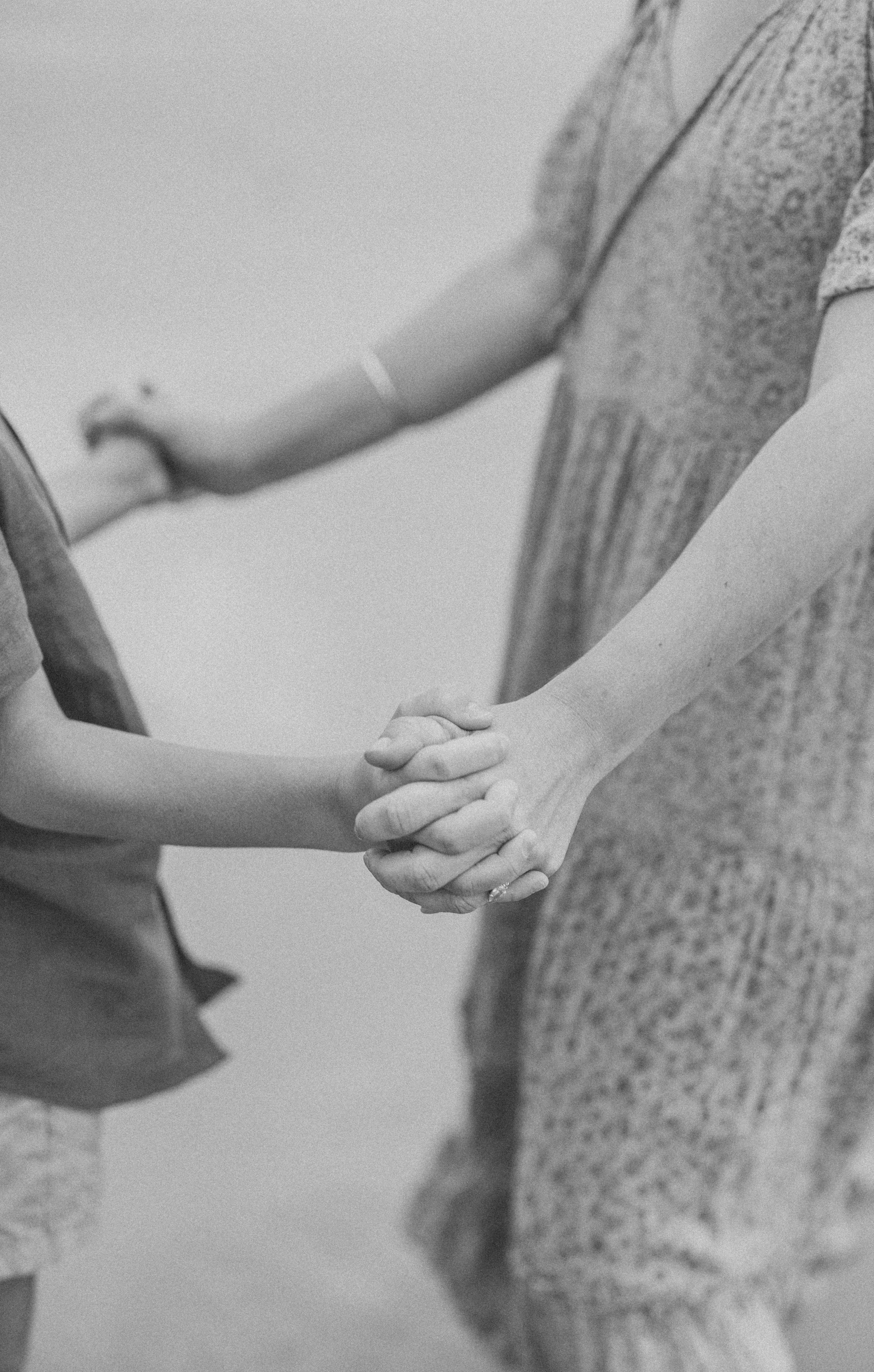 Mum and son grabbing hands