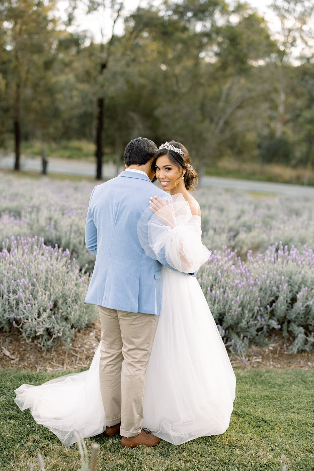 Bride and Groom in lavender field at Sirromet