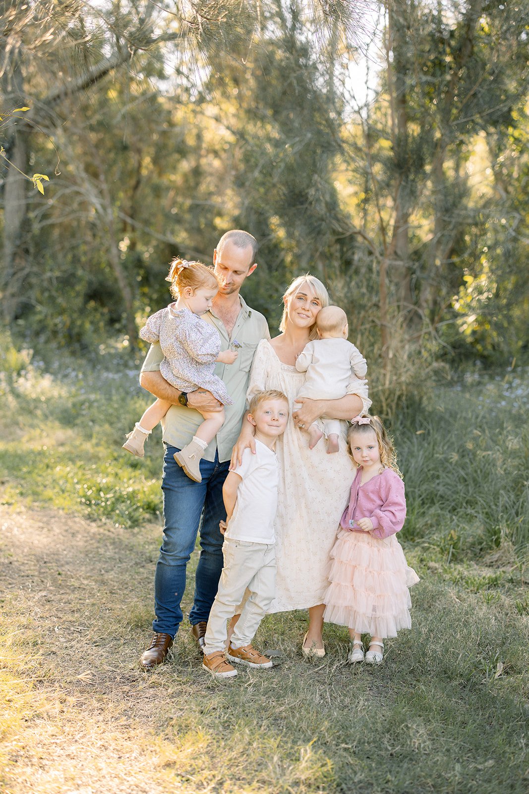 family of 6 photographed in a brisbane park