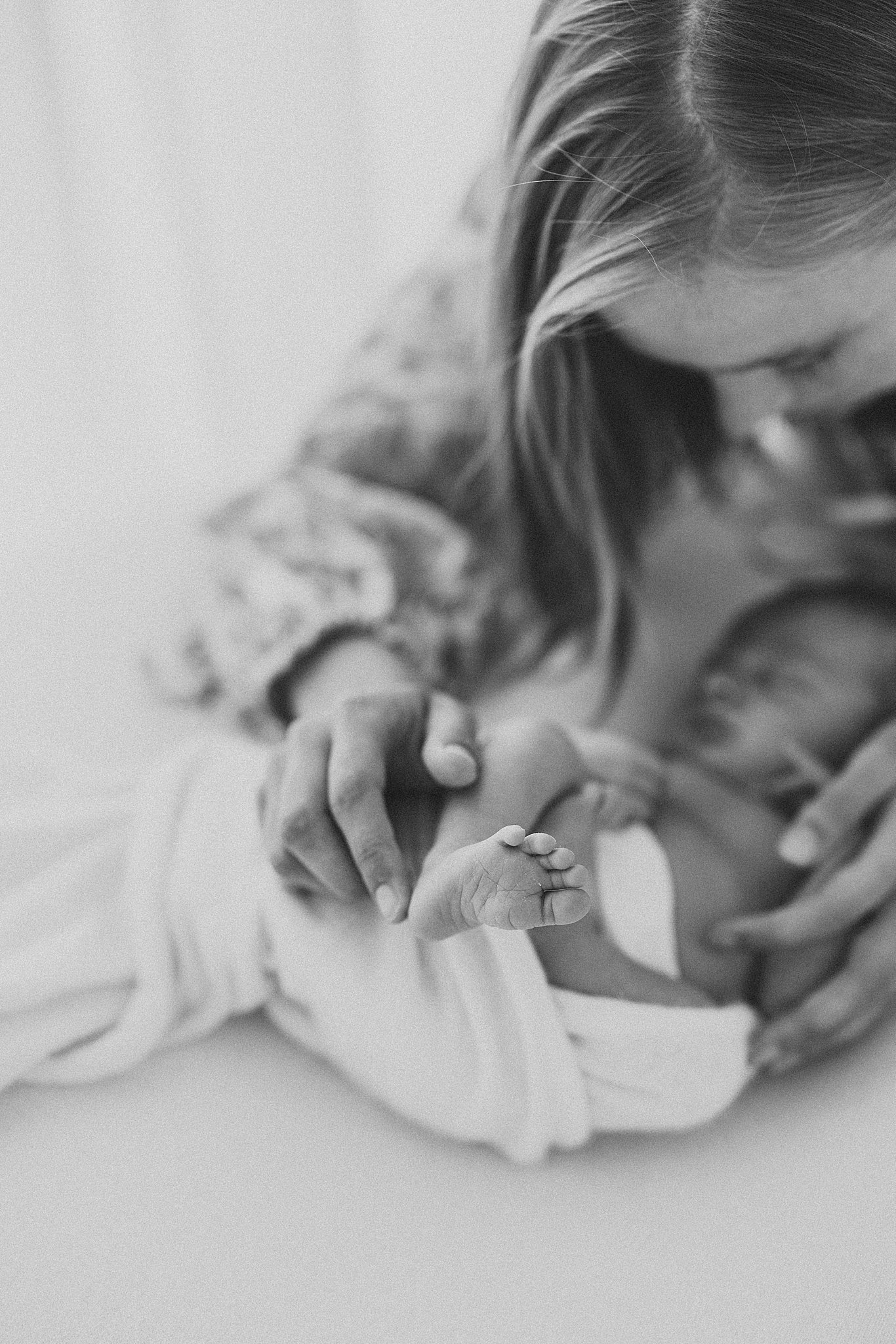 Newborn baby foot in focus