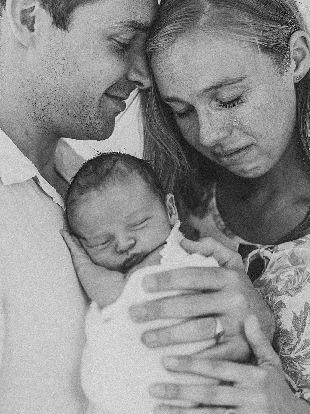 Mother and Father emotion embrace of newborn baby