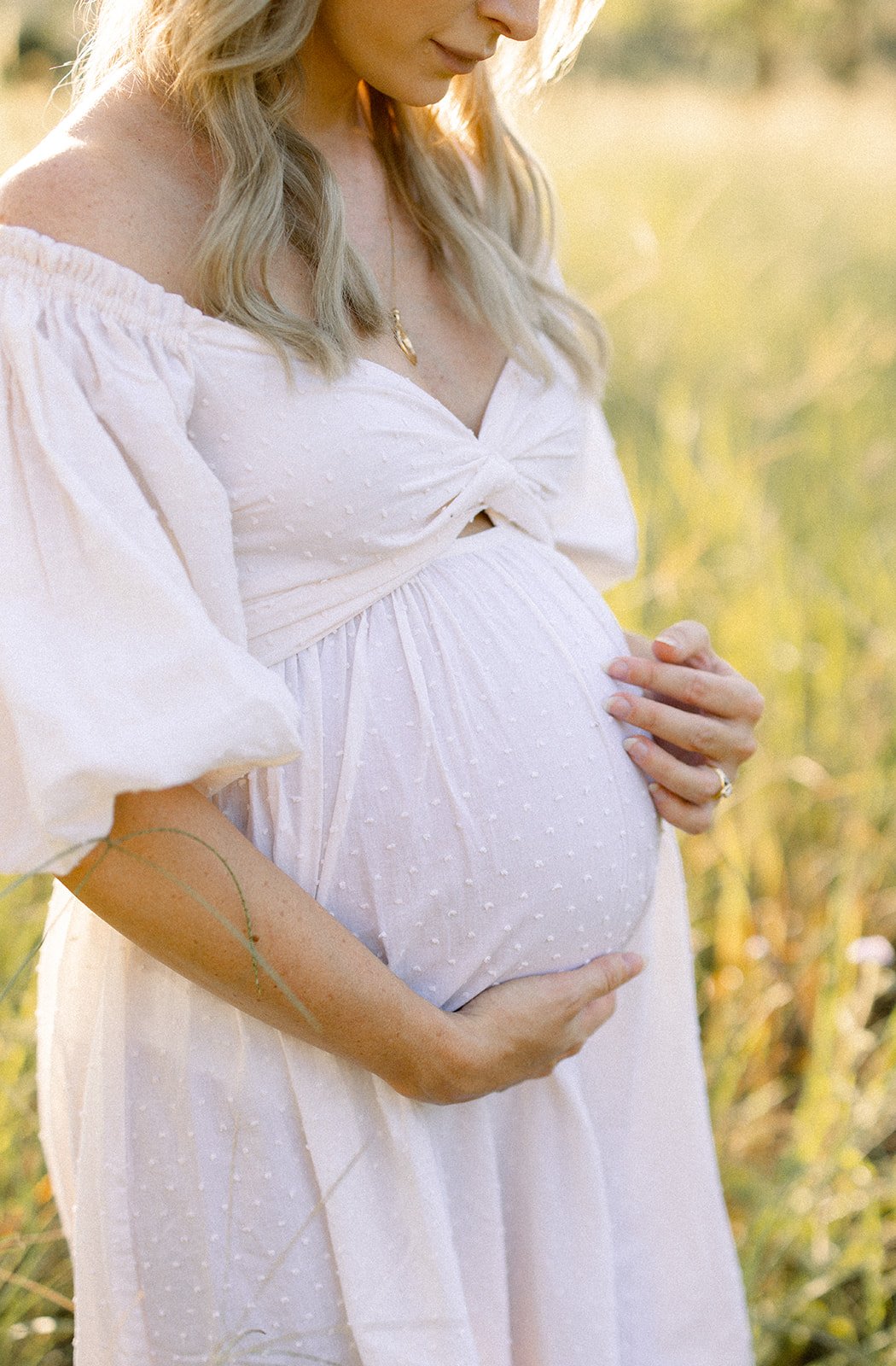 Pregnant belly in white kimono