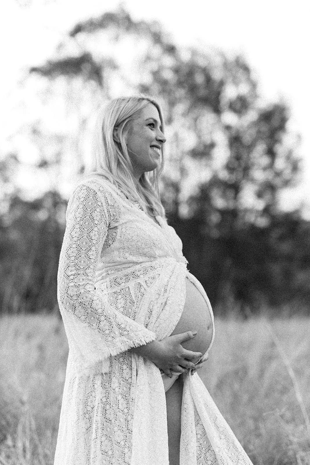 Black and white photograph of a mum to be captured in her maternity session