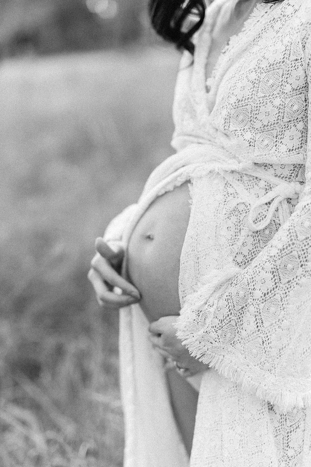 Black and white photograph of a pregnant baby belly 