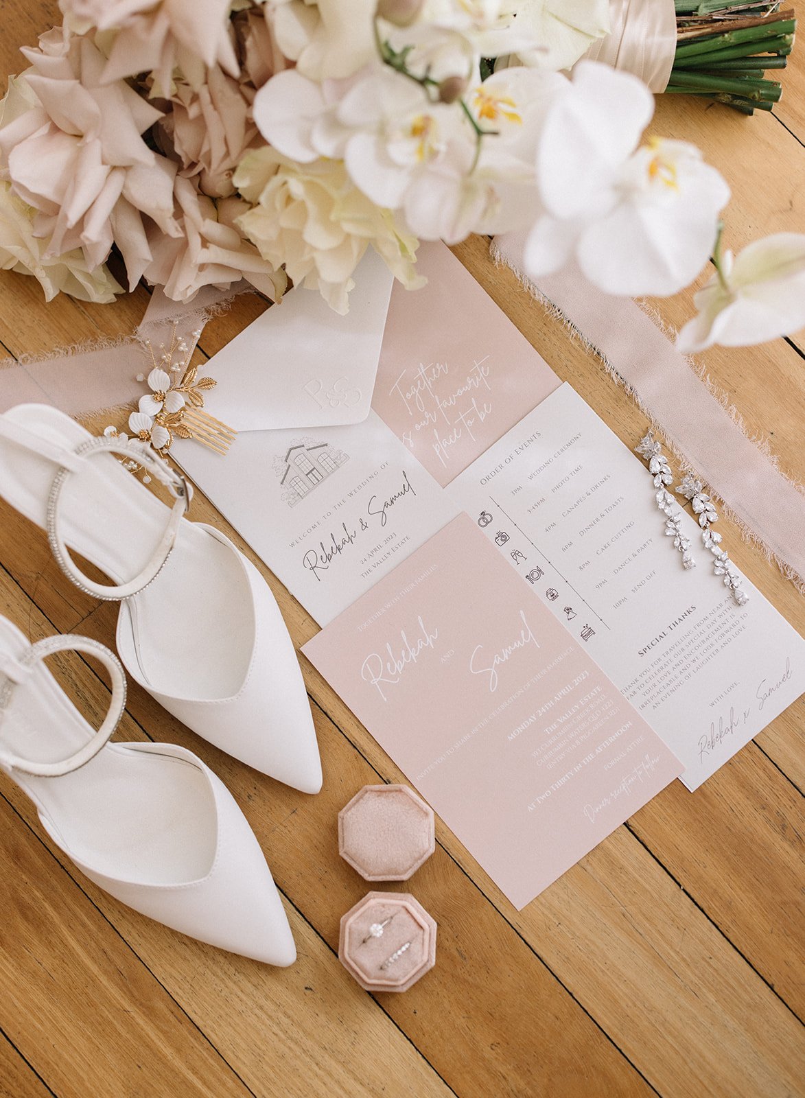  wedding flat lay of stationary and bridal details photographed 