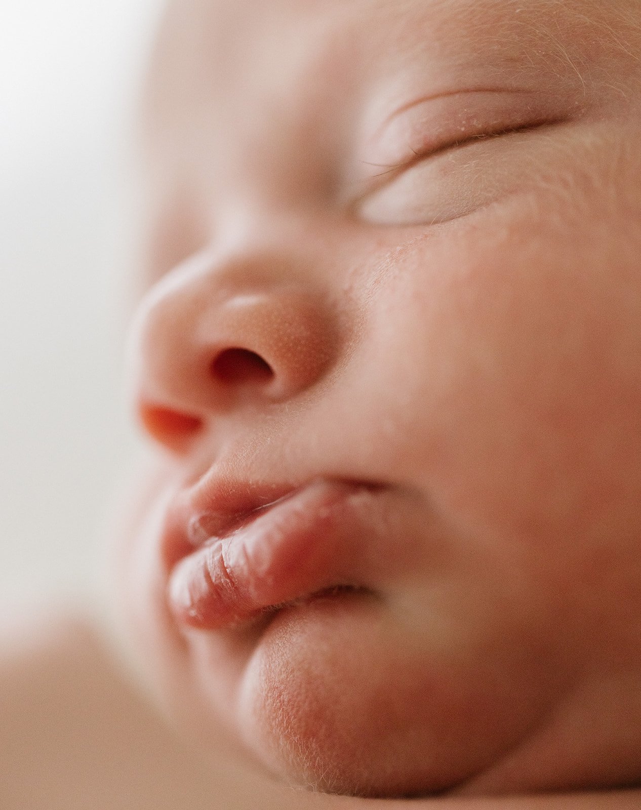 a macro photograph of a newborn babies pouty lips