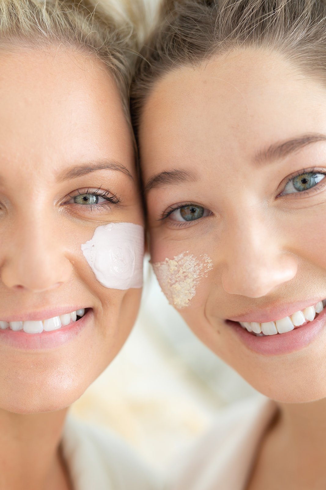 two models have their faces close together each of them has a face mask on their face. Photo was captured for a skincare photoshoot