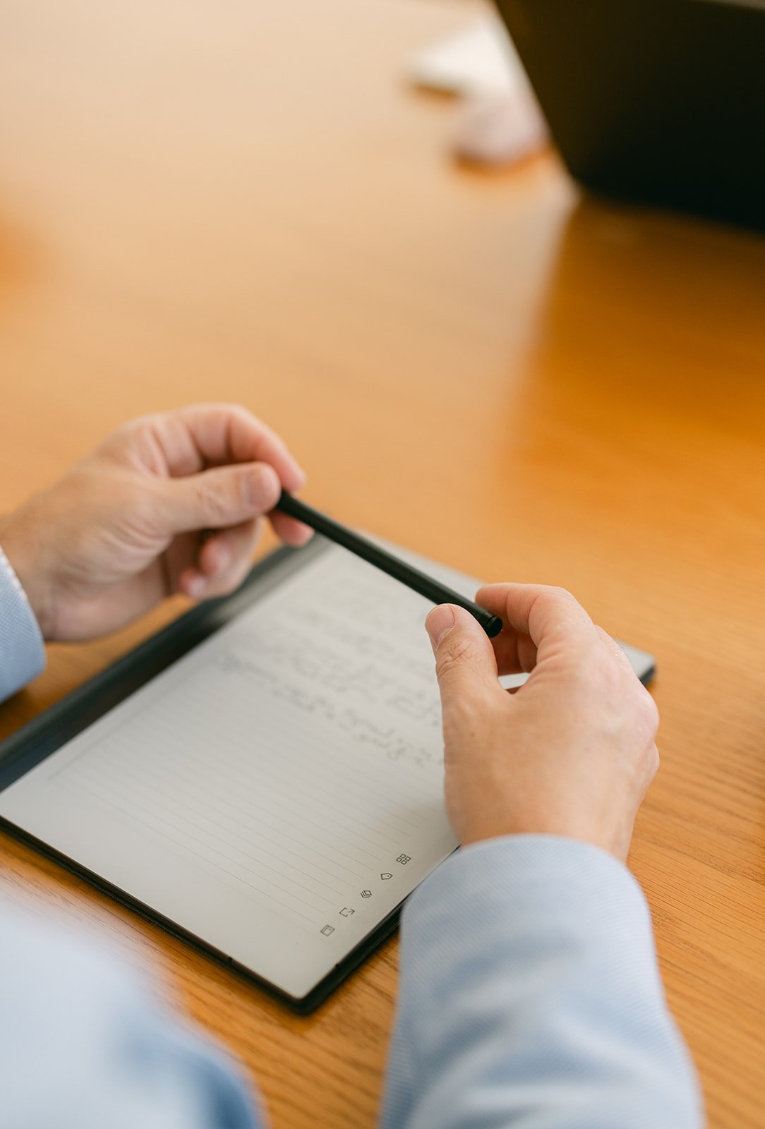 A close up of an electronic pad and pen