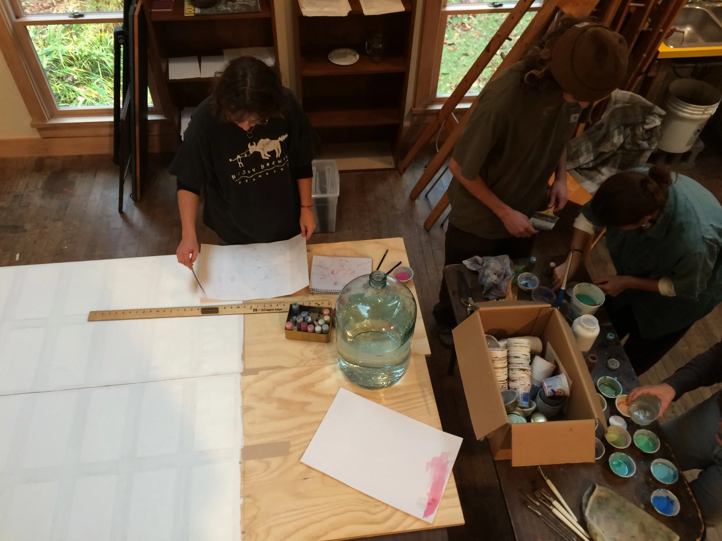 Students of the M.C.Richards Program preparing the cards as a canvas.