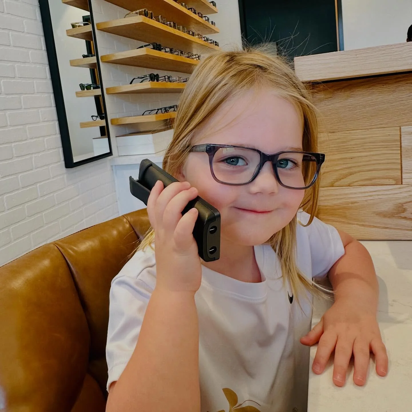 Our littlest assistant stopped into the office last week to help out! She may not be accurate on pricing, hours, or availability, but she&rsquo;s cute and has lots of experience checking out all of our eyes already!! 🤣 ☎️ 🤓 #littlestemployee #goodt