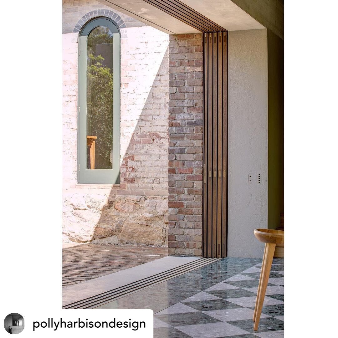 Posted @withregram &bull; @pollyharbisondesign 
Threshold between new and old - the kitchen courtyard area links the existing Federation house to the new addition. Fat walls conceal sliding doors and screens Lindfield House - interiors @arentpykestud