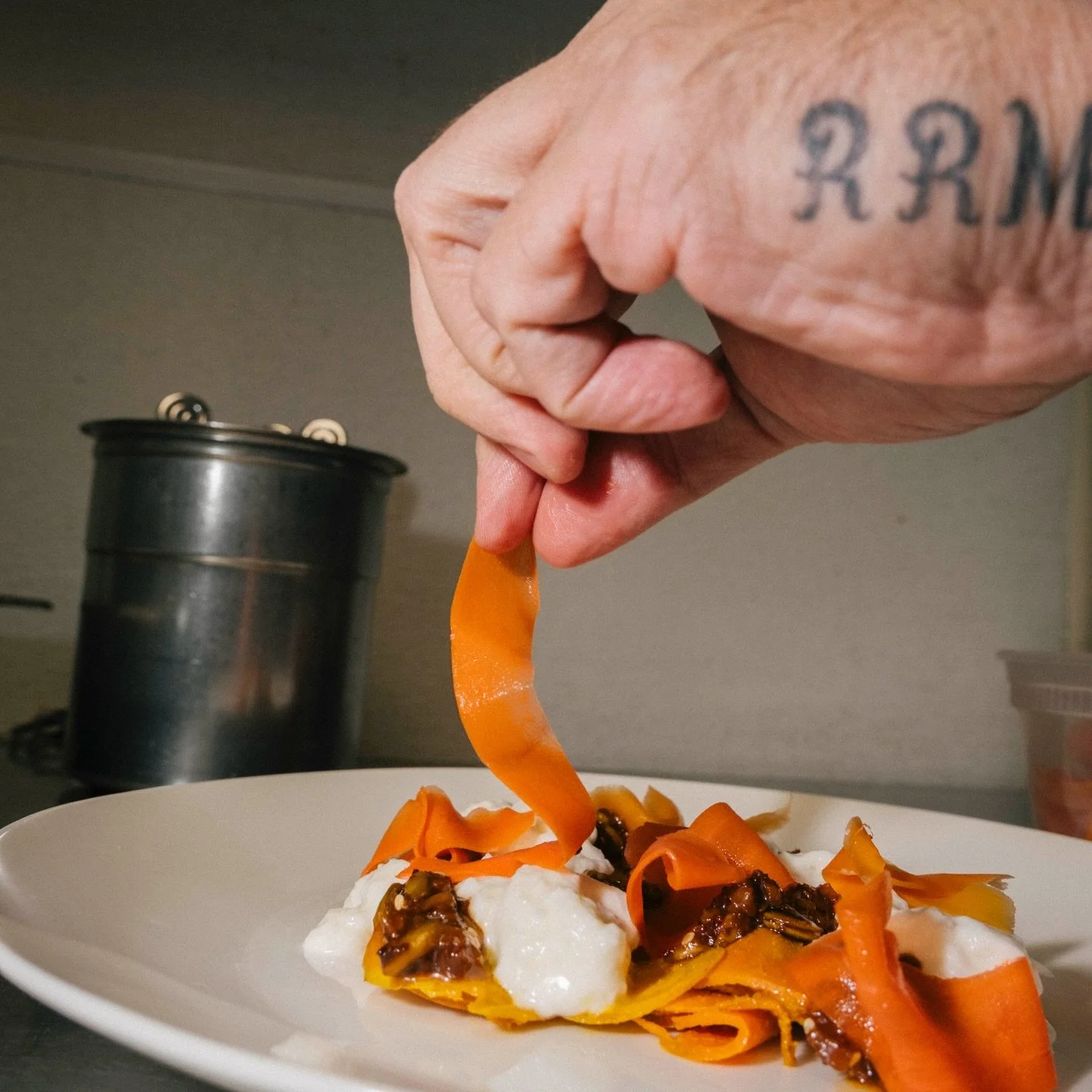 The magic starts at the market. My job is to find the best ingredients and then respect them. These carrots are gently sous vide with citrus and spice, kept al dente, then layered with stracciatella, garlic chili crisp and a little pickled crunch. Si