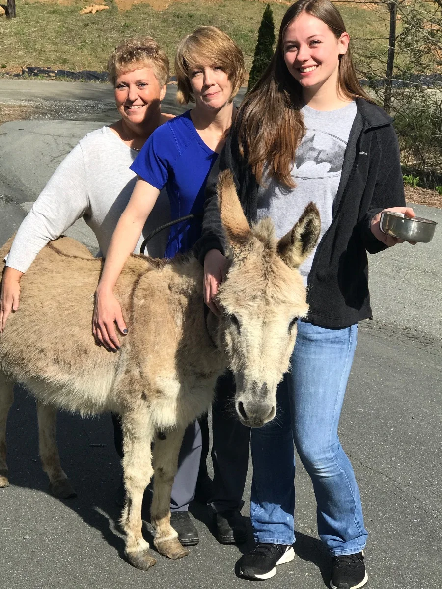 Pedro, with Shelter Staff and new owner.
